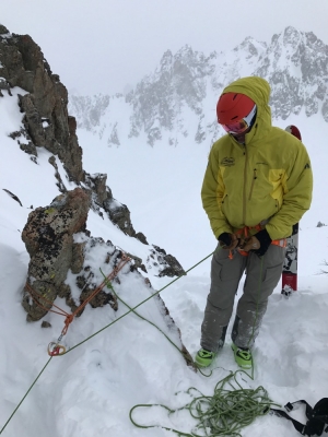 Belaying a skier into the Sickle Couloir in the Sawtooths. 